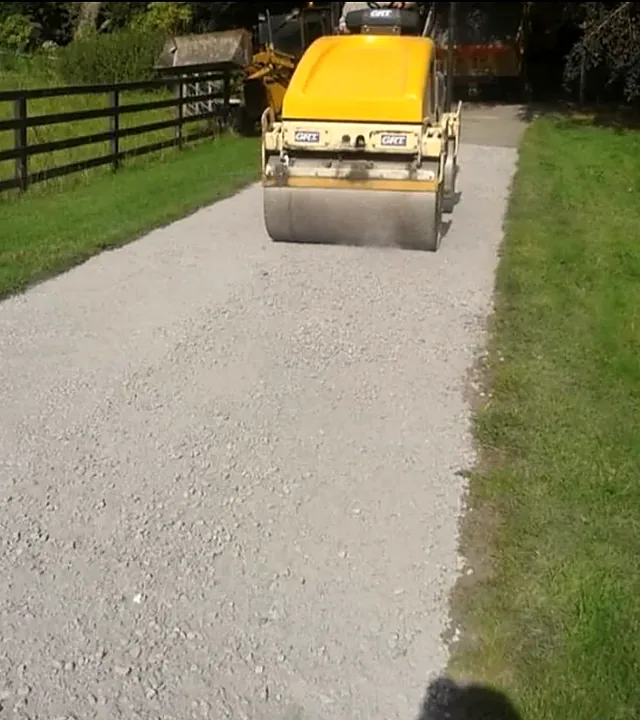 Tar and gravel driveway being rolled in Garryhill, Co. Carlow